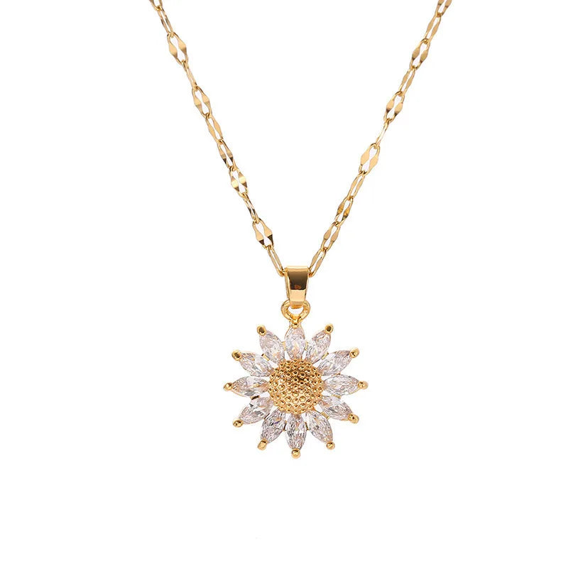 Gold-tone sunflower necklace styled with layered chains and warm tones