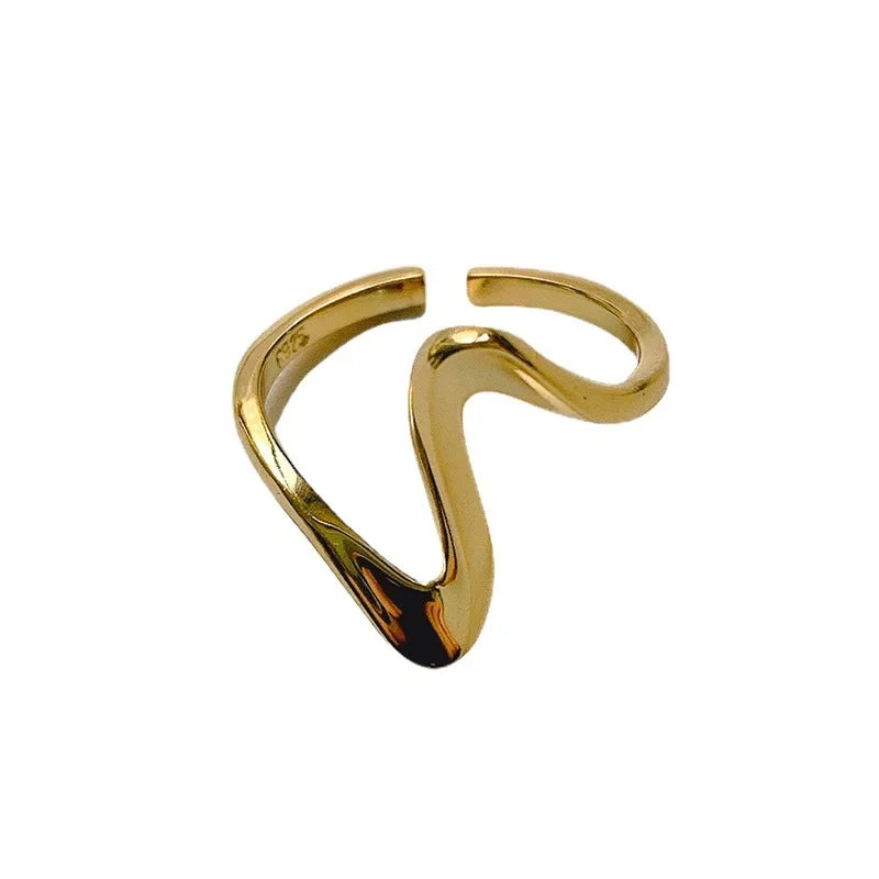 Side view of vintage wave ring showing sculptural silhouette