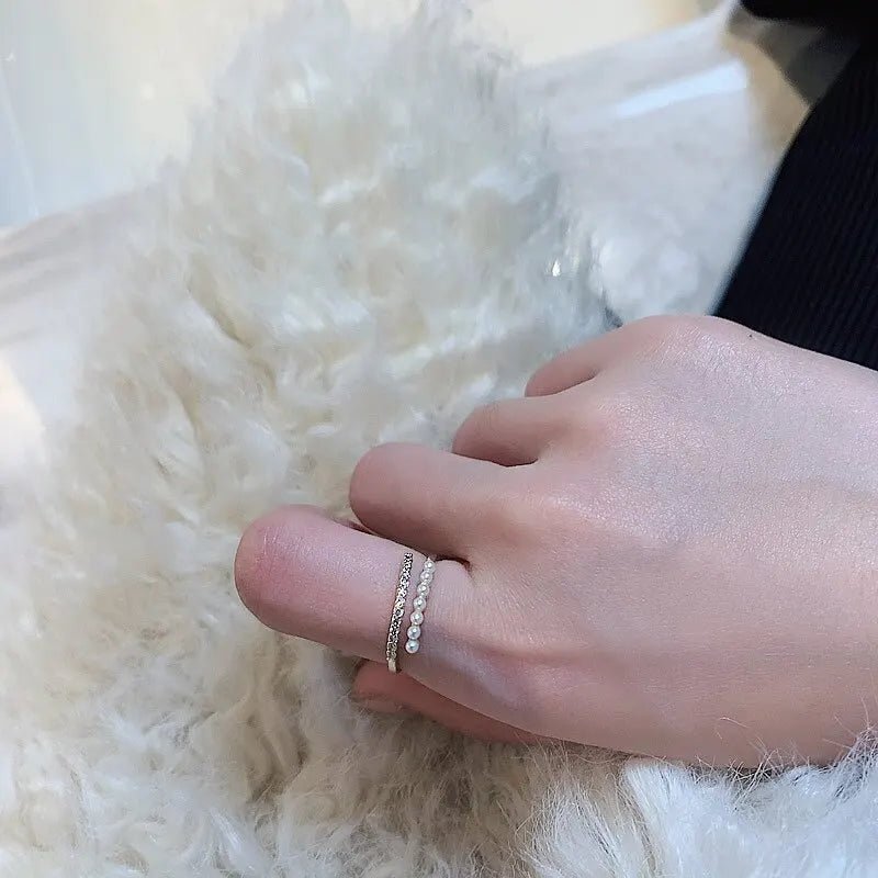 Elegant open ring with pearl – flat lay composition | Dainty Diana