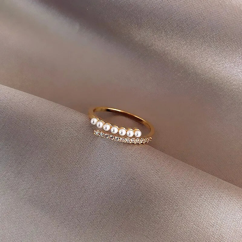 Adjustable gold ring with simulated pearl – angled shot | Dainty Diana