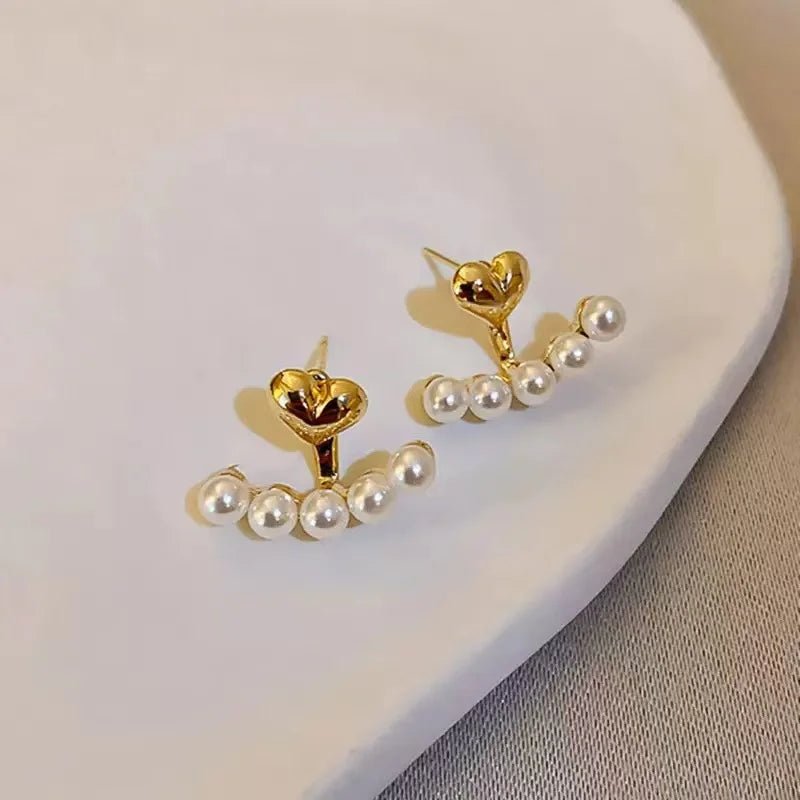 Heart pearl stud earrings in soft gold – front view | Dainty Diana
