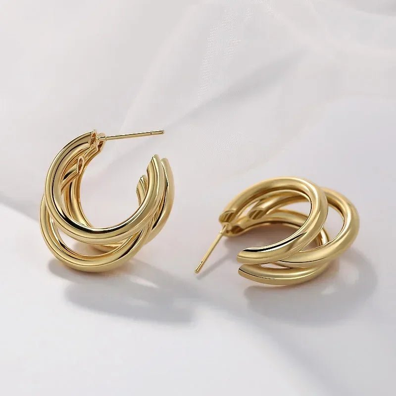 Close-up of polished gold hoop texture | Dainty Diana