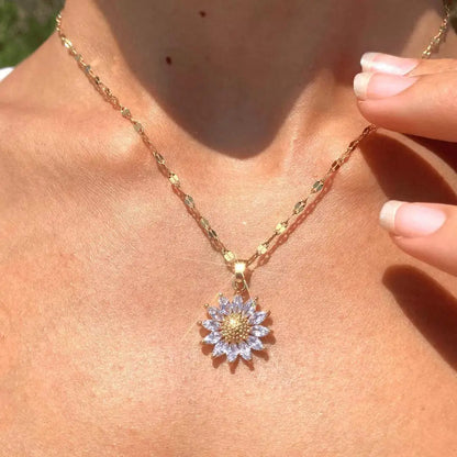 Model wearing gold-tone sunflower necklace with minimalist outfit