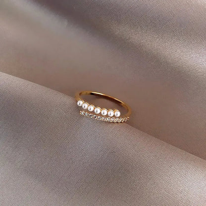 Adjustable gold ring with simulated pearl – angled shot | Dainty Diana