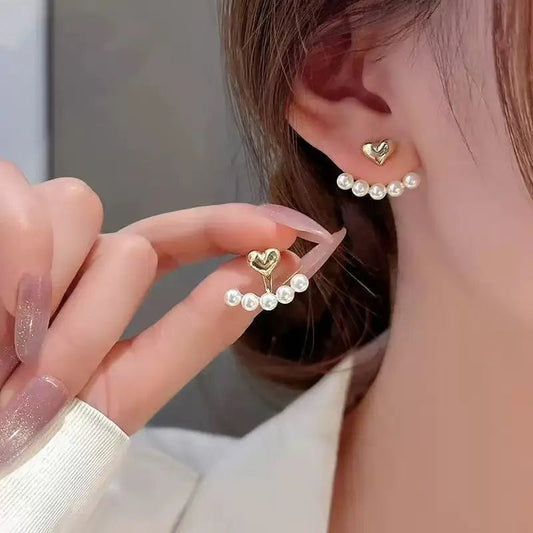 Heart-shaped studs – worn on model | Dainty Diana
