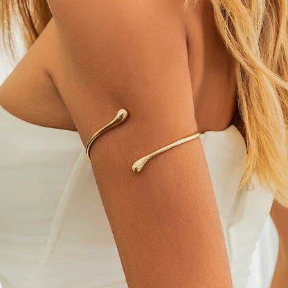 Waterdrop open cuff bracelet in soft gold – front view | Dainty Diana